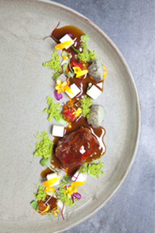 Braised lamb shoulder with coriander and pisco jus, black quinoa and white grape