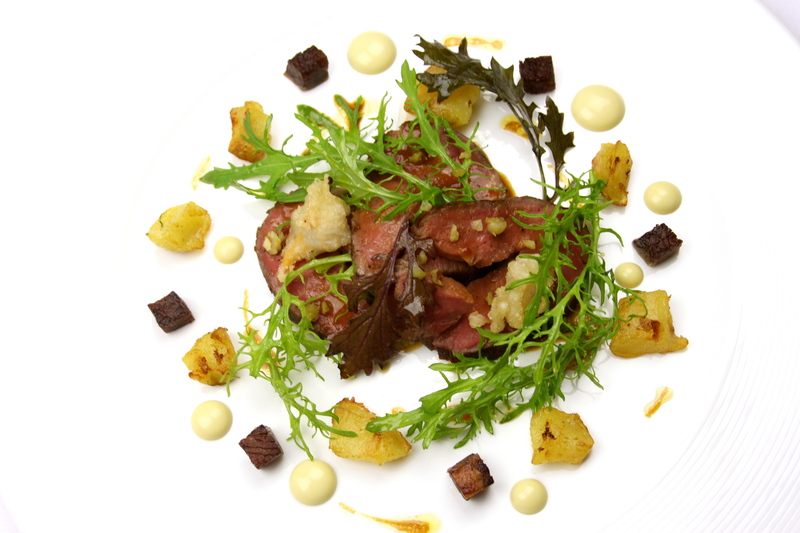 Roast Sirloin of Longhorn Beef with nasturtium pastrami oyster & pickled cockles